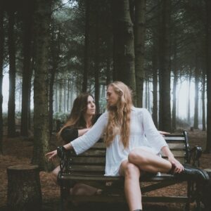 Aimie and Chloe of True Foxes sitting in a wood