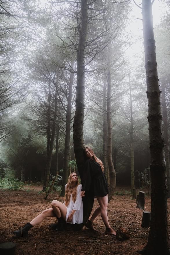 Aimie and Chloe of True Foxes sitting in a wood